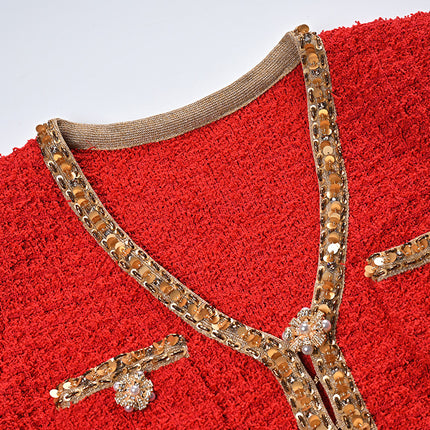 Elegant red tweed jacket with gold embellishments paired with a matching midi skirt, ideal for formal occasions