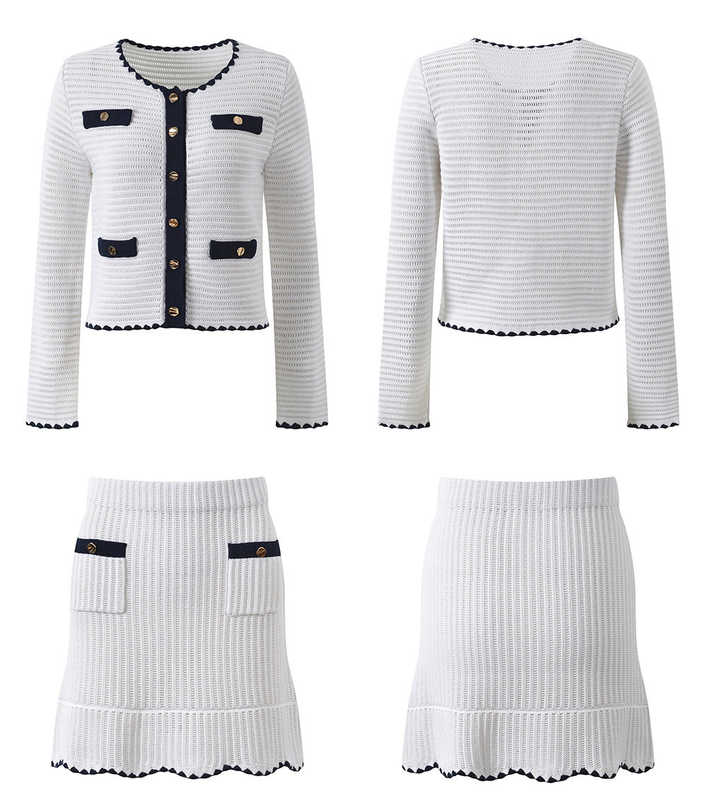 White knit cardigan with navy accents and gold buttons paired with a matching A-line skirt featuring a flared hem