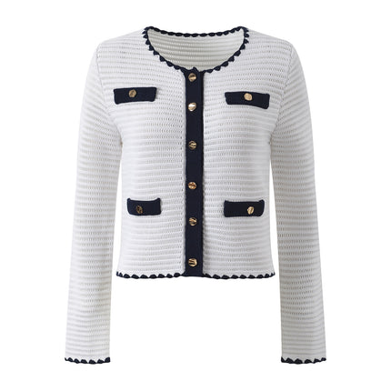 White knit cardigan with navy accents and gold buttons paired with a matching A-line skirt featuring a flared hem