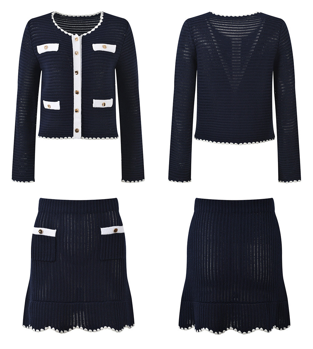 White knit cardigan with navy accents and gold buttons paired with a matching A-line skirt featuring a flared hem