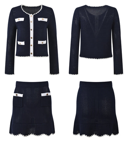 White knit cardigan with navy accents and gold buttons paired with a matching A-line skirt featuring a flared hem