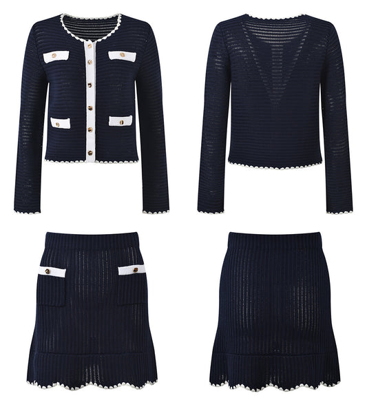 White knit cardigan with navy accents and gold buttons paired with a matching A-line skirt featuring a flared hem