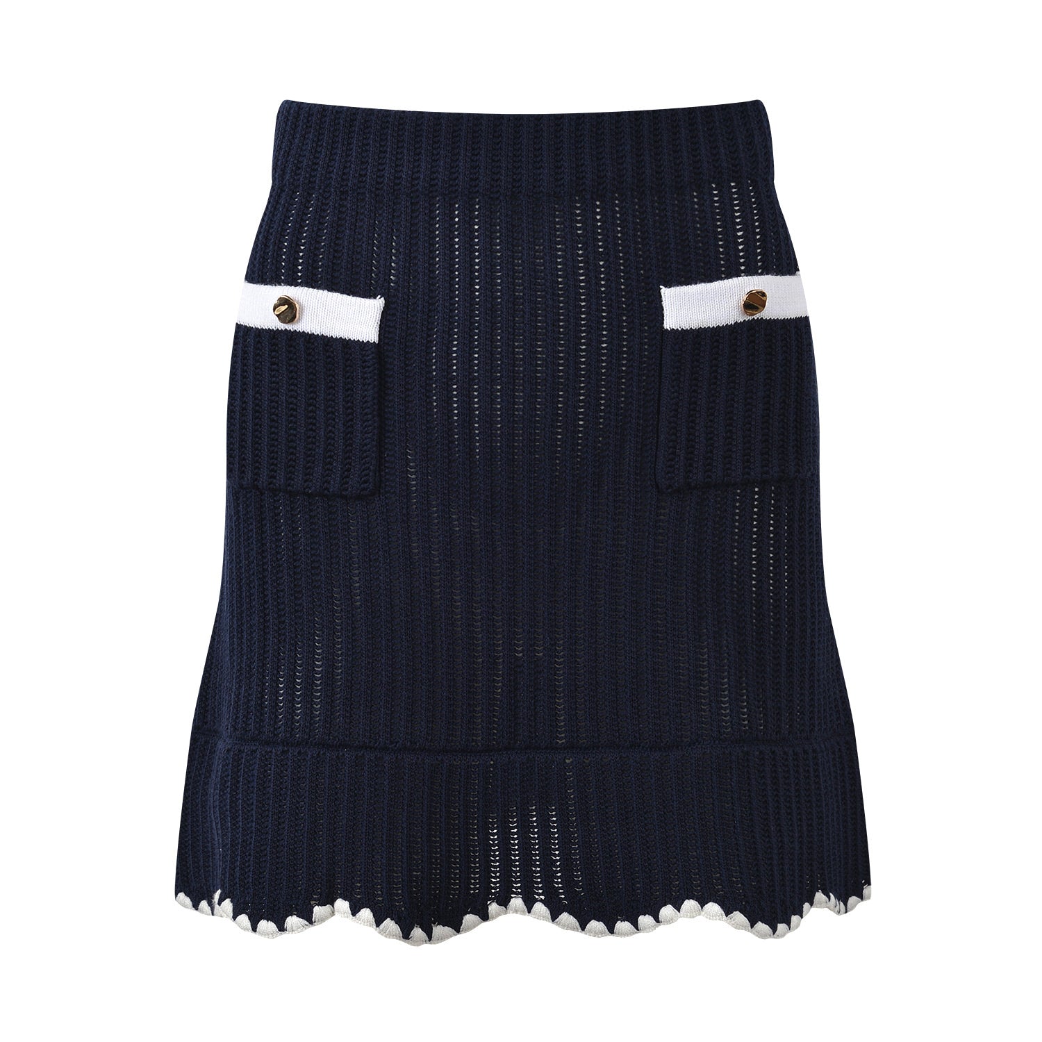White knit cardigan with navy accents and gold buttons paired with a matching A-line skirt featuring a flared hem