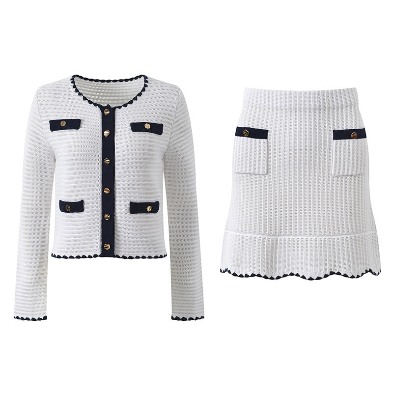 White knit cardigan with navy accents and gold buttons paired with a matching A-line skirt featuring a flared hem