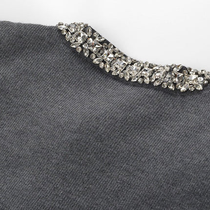 Gray knit cardigan and skirt set with crystal embellishments