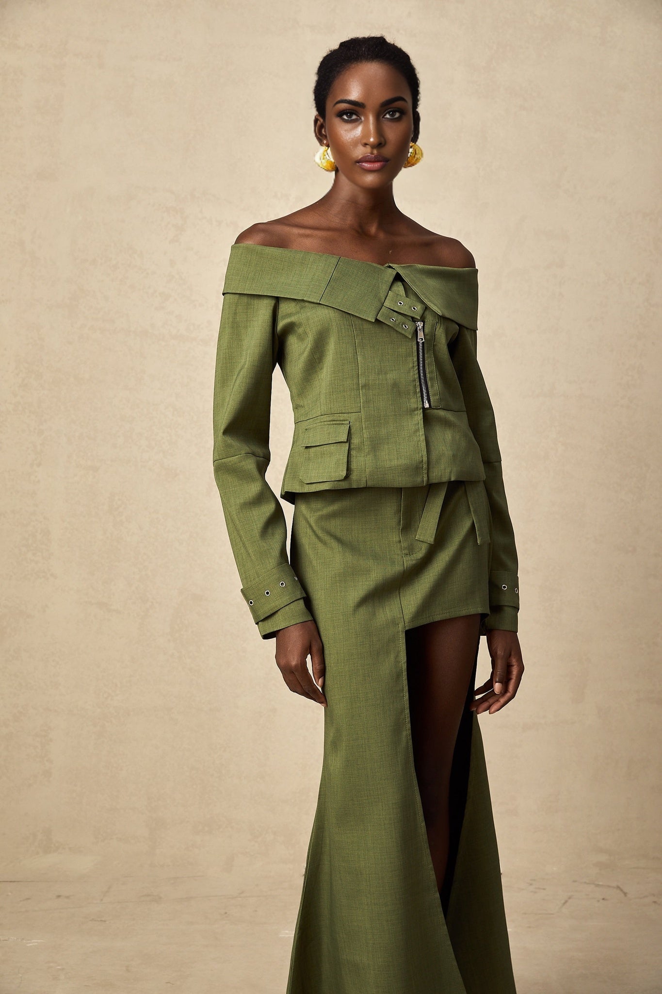 Green asymmetric jacket and skirt set named Elena featuring matching design