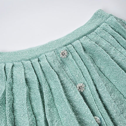 Green Chanel-inspired tailored cropped jacket and pleated mini skirt in soft mint hue