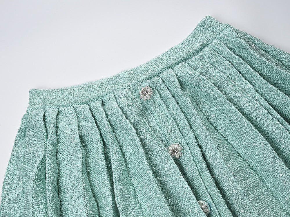 Green Chanel-inspired tailored cropped jacket and pleated mini skirt in soft mint hue