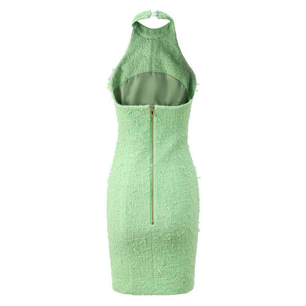 Green halter neck dress with rhinestone accents and button closure