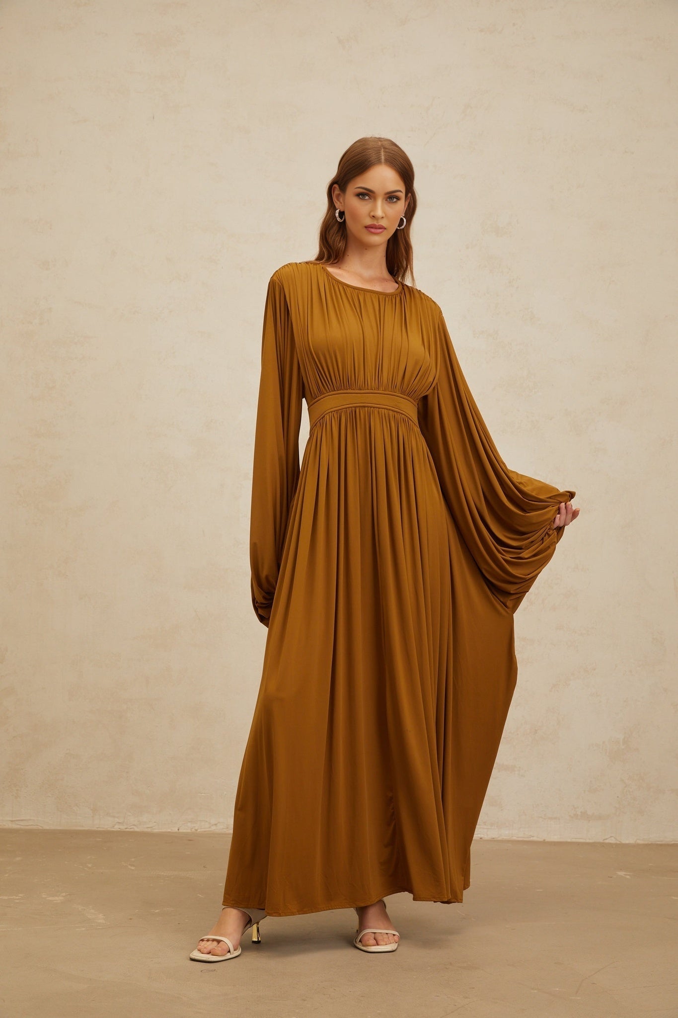 Green long puff sleeve maxi dress with cinched waist and pleated detailing