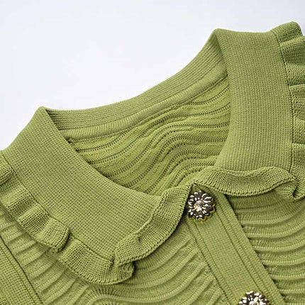 Green ruffled sleeveless top with wave pattern