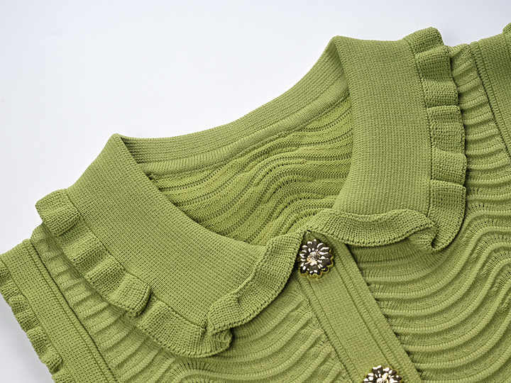 Green ruffled sleeveless top with wave pattern
