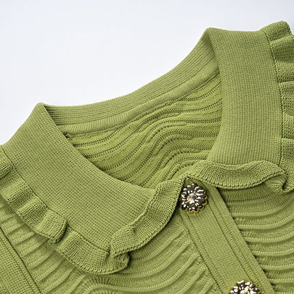 Green ruffled sleeveless top with wave pattern