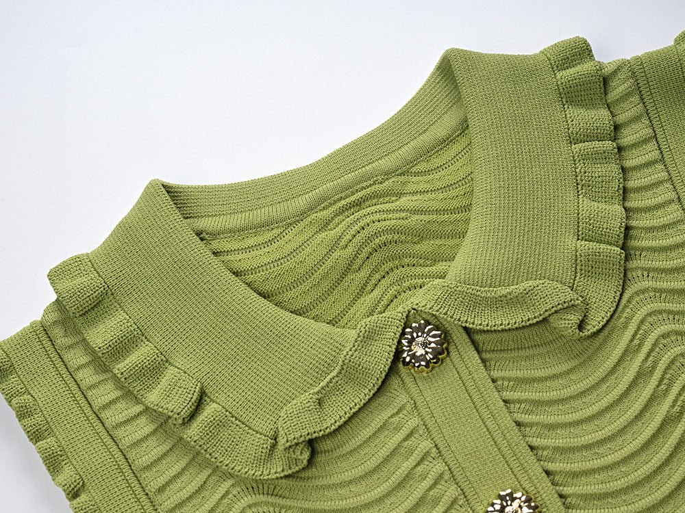 Green ruffled sleeveless top with wave pattern