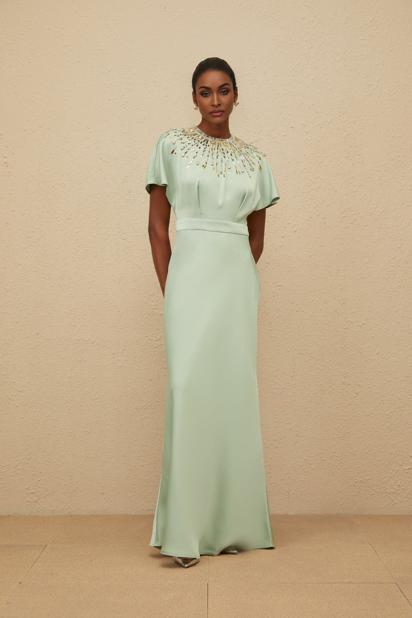 Green satin maxi dress with sequin, crystal, and bead embellishments