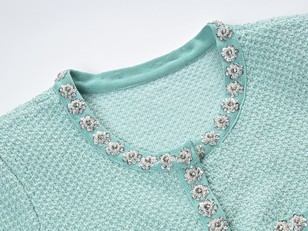 Green textured fabric dress with decorative buttons and pockets