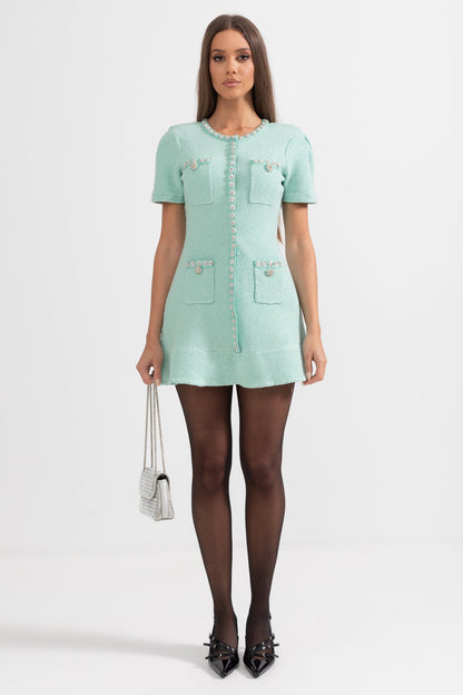 Green textured fabric flared skirt with decorative buttons and pockets