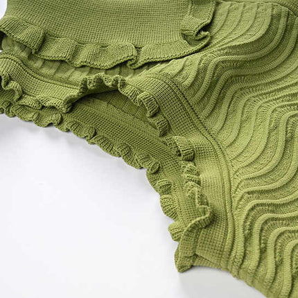 Green textured wave pattern sleeveless top with ruffled edges
