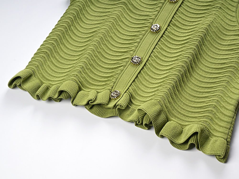 Green textured wave pattern sleeveless top with ruffled edges