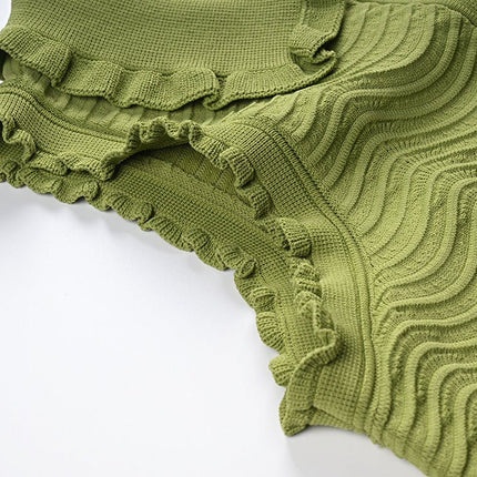 Green textured wave pattern sleeveless top with ruffled edges