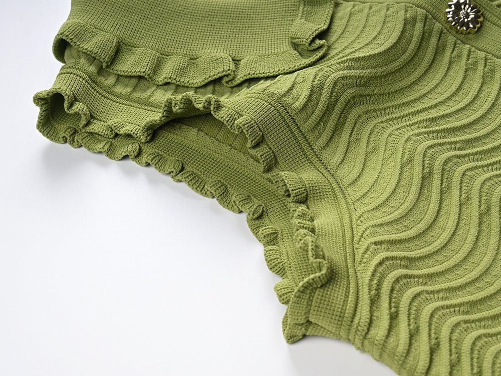 Green textured wave pattern sleeveless top with ruffled edges