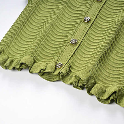 Green textured wave pattern sleeveless top with ruffled edges