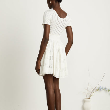 Greta White Knitted Mini Dress with Fitted Waistline and Pleated Design