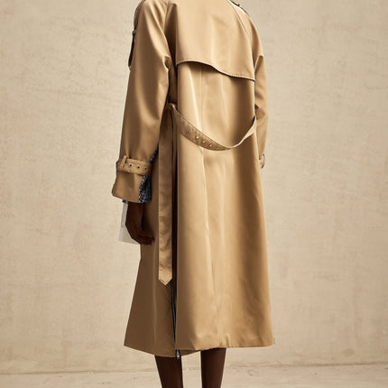 Heres a simple alt text for the product image based on the title

Woman wearing long beige trench coat with contrasting dark trim and belt tied at waist featuring allover print pattern