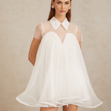 Hope Mini Dress in White Tulle Lace Trim Flounce Hem Lapels Short Sleeves Loose Fit Semi-Sheer Pressed Crease Detailing Rear Button Fastening