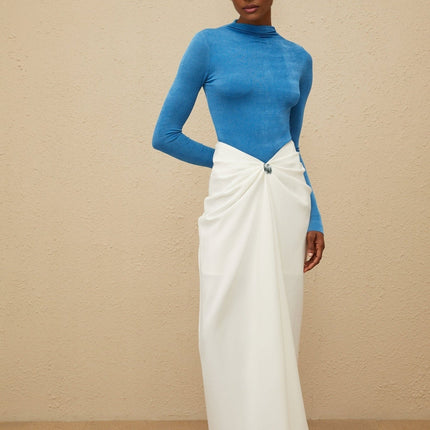 Hunter wearing Blue Bodysuit and White Maxi Skirt Set