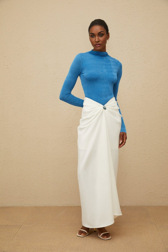 Hunter wearing Blue Bodysuit and White Maxi Skirt Set