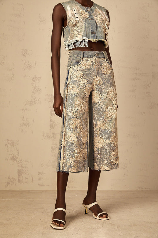 Iliana Blue Lace Panel Wide Leg Jeans Premium Denim High Rise Wide Leg Silhouette Lace Panelling Floral-Lace Detailing Contrast Stitching Frayed Edges Belt Loops Front Button Zip Fastening Five Pockets Cropped Length Luxury Versatility 100% Cotton