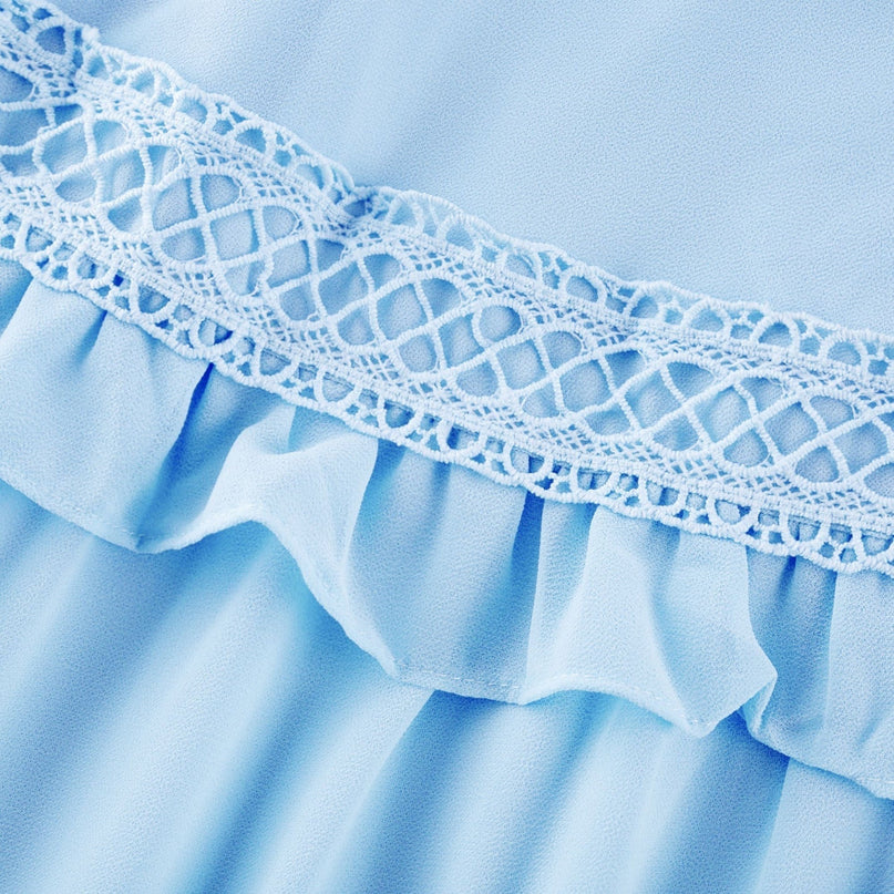 Image of a long blue maxi dress named Juno featuring cutout details and ruffles