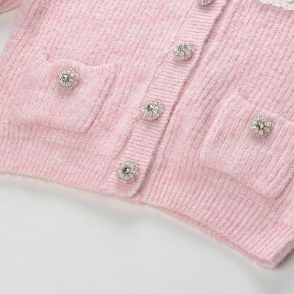 Pastel pink knit cardigan with lace collar and crystal buttons paired with a matching flared skirt