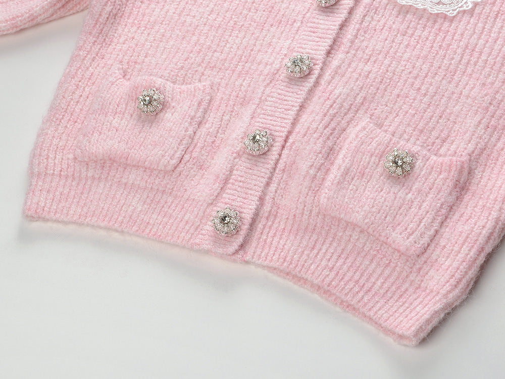 Pastel pink knit cardigan with lace collar and crystal buttons paired with a matching flared skirt