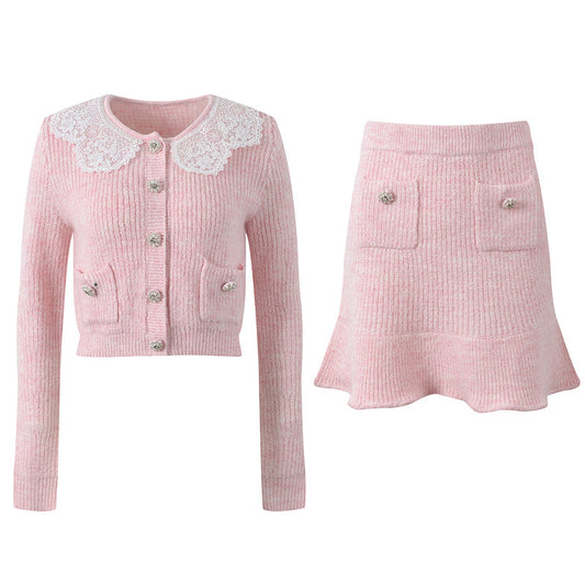 Pastel pink knit cardigan with lace collar and crystal buttons paired with a matching flared skirt