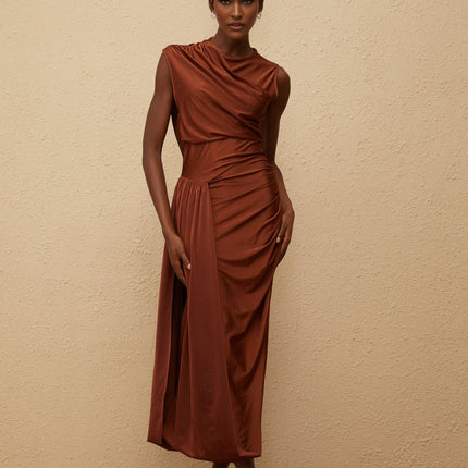 Ivanka Maxi Dress in mesmerizing brown with crew neck, fitted waistline, ruched detailing, asymmetrical design, and side slit for modern elegance and convenience