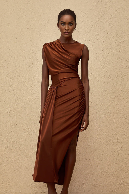 Ivanka Maxi Dress in mesmerizing brown with crew neck, fitted waistline, ruched detailing, and side slit for modern elegance and convenience