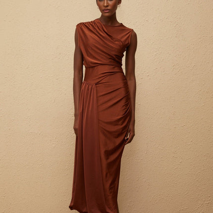 Ivanka Maxi Dress in mesmerizing Brown with crew neck and fitted waistline, ruched detailing and side slit for modern elegance and convenience