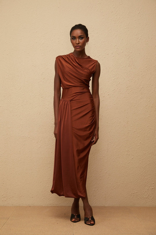 Ivanka Maxi Dress in mesmerizing Brown with crew neck and fitted waistline, ruched detailing and side slit for modern elegance and convenience