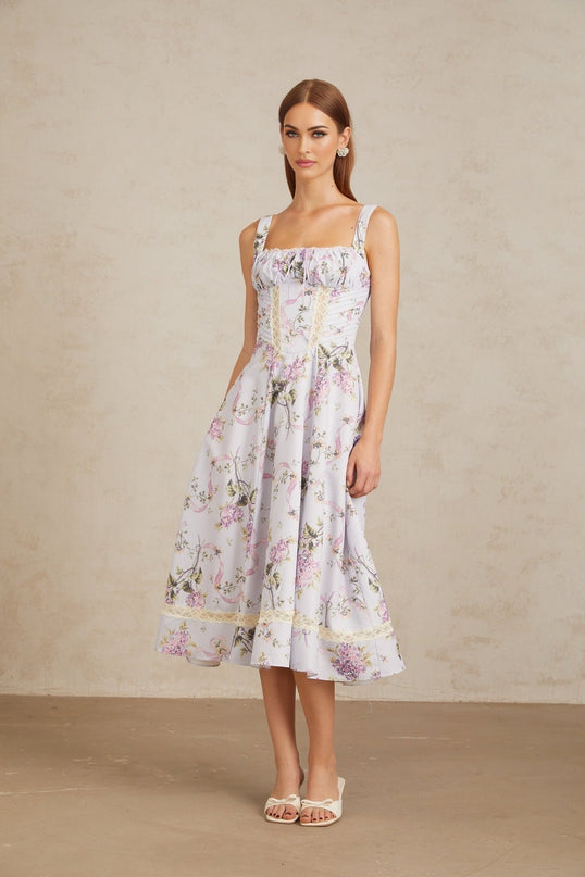 Ivanka Midi Dress in Purple Lilac Multicolor Elegant Square Neck Sleeveless Floral Lace Trim Boned Bodice Fitted Waistline Self-Tie Bow Shirred Flounce Skirt Special Occasion Cotton Spandex Blend Rear Zip Fastening