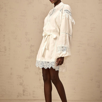 Ivanka White Lace Mini Dress with Ruffle Bow Trim and Crystal-Embellished Buttons