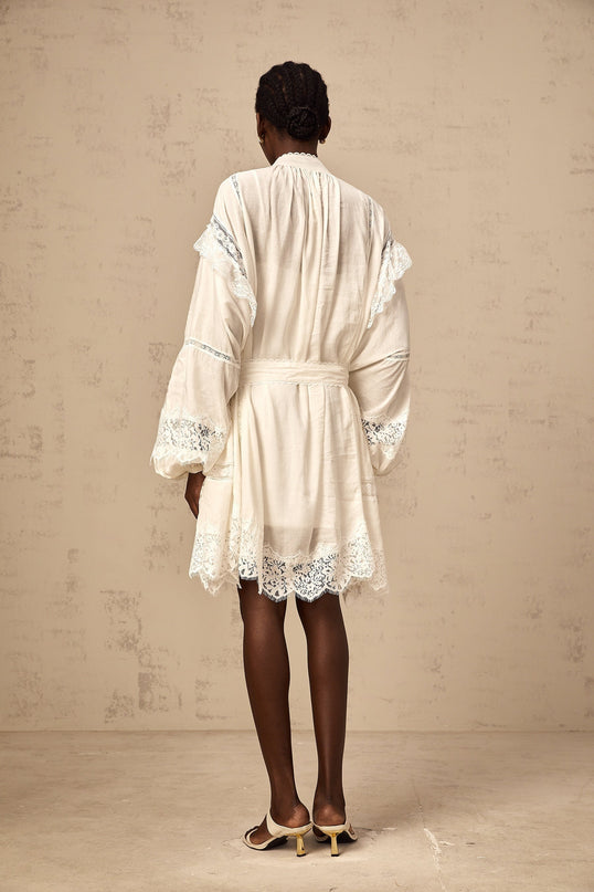 Ivanka White Lace Mini Dress with Ruffle Bow Trim and Crystal-Embellished Buttons