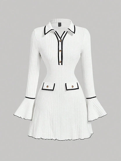 White ribbed knit dress with contrast trim, gold button accents, flared sleeves, and a tailored fit for a sophisticated and modern look