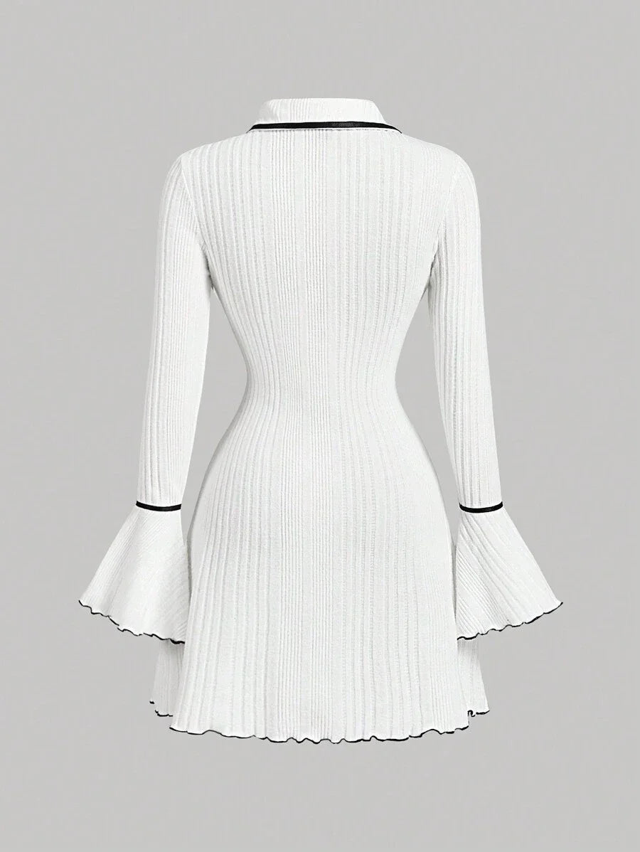 White ribbed knit dress with contrast trim, gold button accents, flared sleeves, and a tailored fit for a sophisticated and modern look