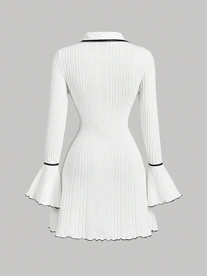 White ribbed knit dress with contrast trim, gold button accents, flared sleeves, and a tailored fit for a sophisticated and modern look