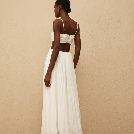 Jacqueline Maxi Dress in White Terylene Fiber Sweetheart Neckline Sleeveless Adjustable Spaghetti Straps Cut-Out Detailing Pleated Embellishments Crystal Embellishments Smocked Panel Rear Zip Fastening Maxi-Length Dress