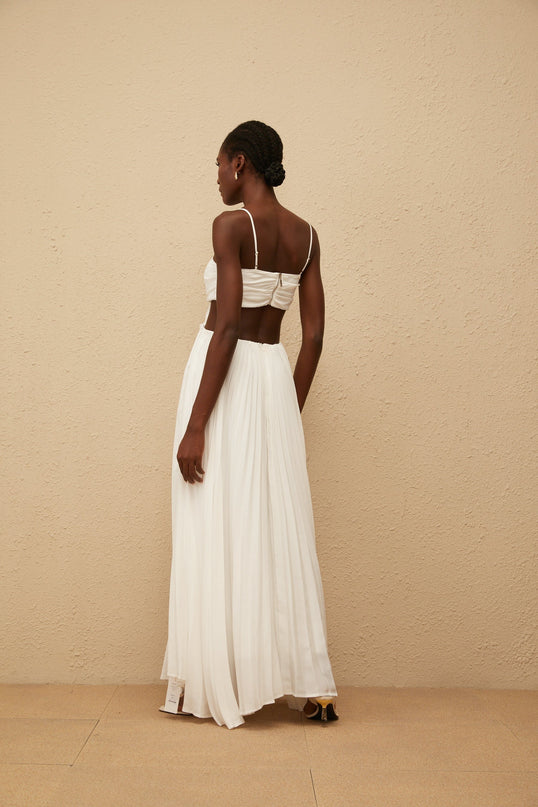 Jacqueline Maxi Dress in White Terylene Fiber Sweetheart Neckline Sleeveless Adjustable Spaghetti Straps Cut-Out Detailing Pleated Embellishments Crystal Embellishments Smocked Panel Rear Zip Fastening Maxi-Length Dress