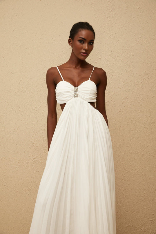Jacqueline Maxi Dress in White Terylene Fiber Sweetheart Neckline Sleeveless Design Adjustable Straps Cut-Out Detailing Pleated Embellishments Crystal Embellishments Smocked Panel Rear Zip Fastening Maxi-Length Dress