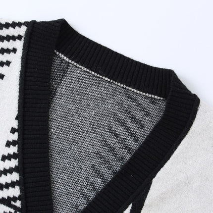 Jane wearing black and white plaid cardigan sweater with V-neckline and full sleeves